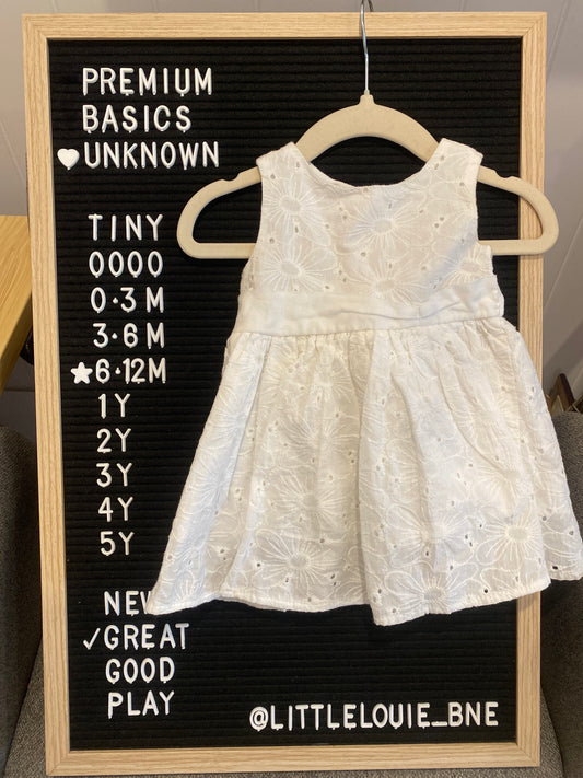 White sleeveless broderie anglaise dress with tie bow