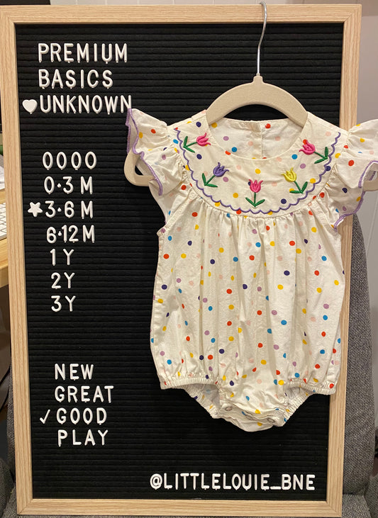 Cream romper with colourful spots and embroidered flowers