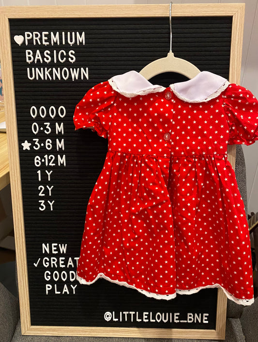 Red capped sleeve dress with white spots, waist smocking and embroidered collar