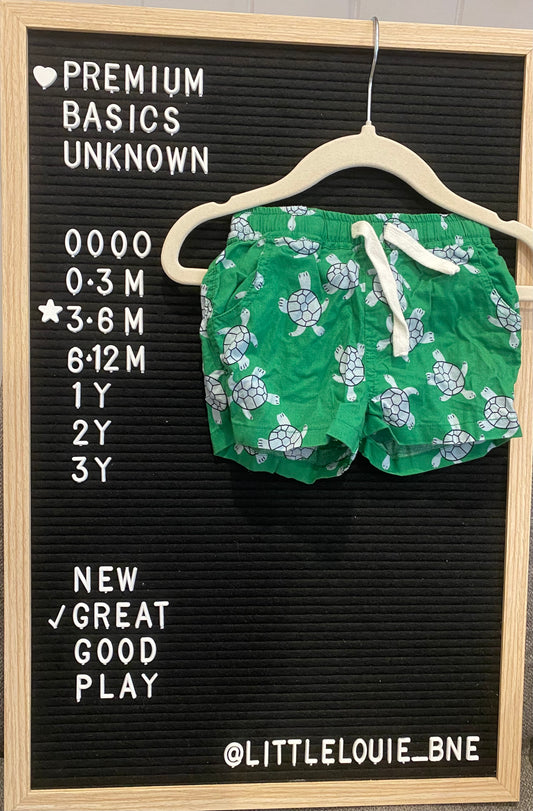 Green shorts with turtle print